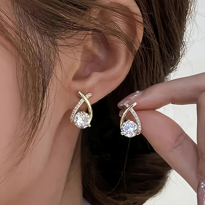 Pendientes de cruz en circonio color oro