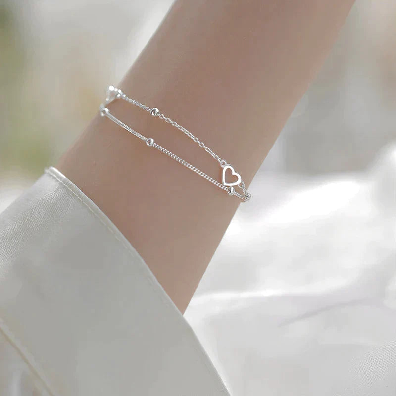 Pulsera de plata ajustable con colgante en forma de corazón