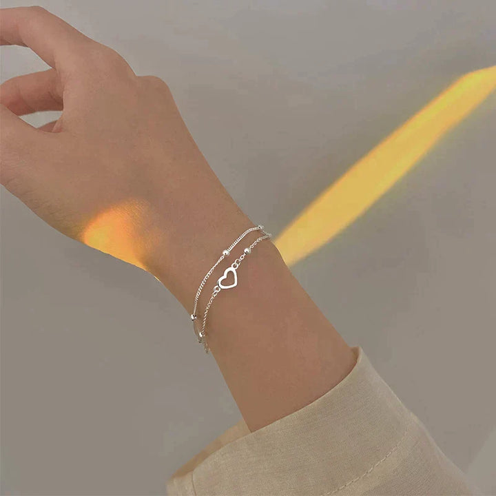 Pulsera de plata ajustable con colgante en forma de corazón