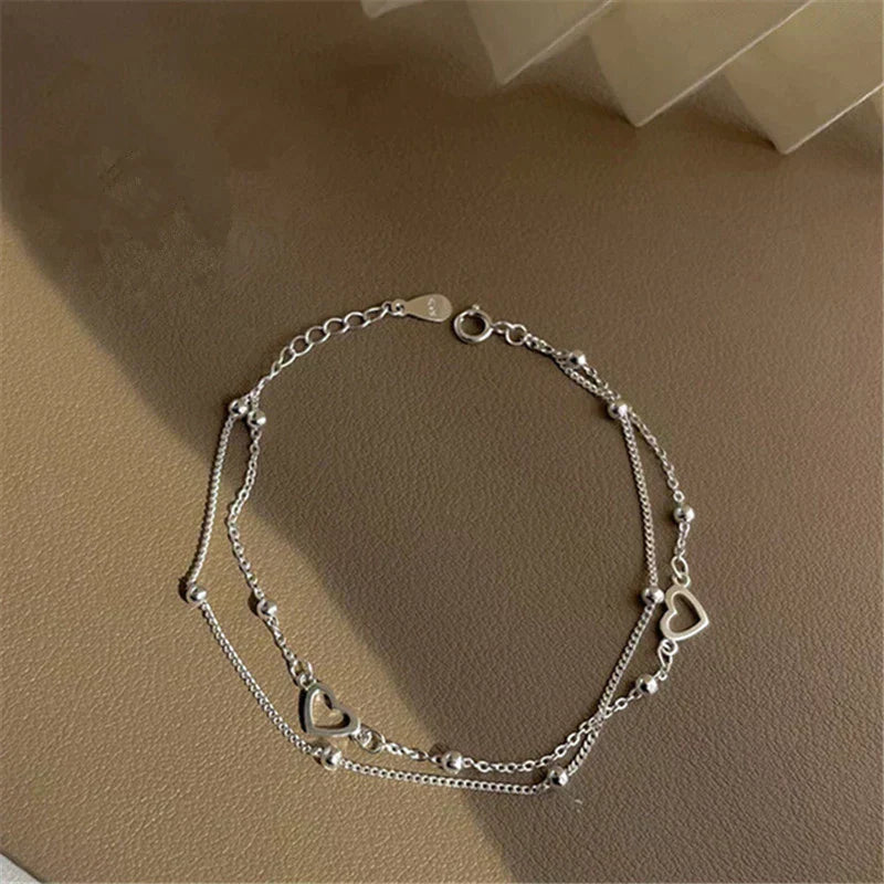 Pulsera de plata ajustable con colgante en forma de corazón