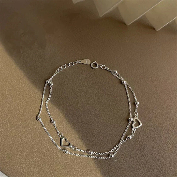 Pulsera de plata ajustable con colgante en forma de corazón