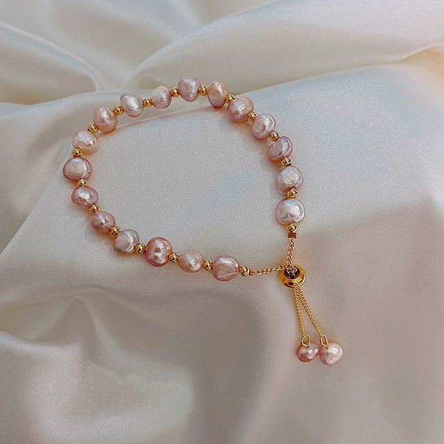 Pulsera de oro con perlas rosas