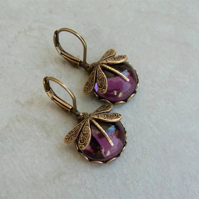 Pendientes vintage esféricos dorados con libélula
