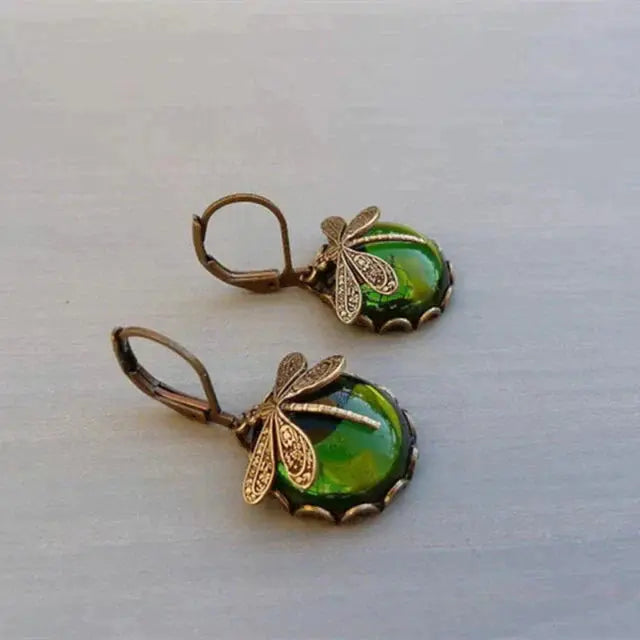 Pendientes vintage esféricos dorados con libélula