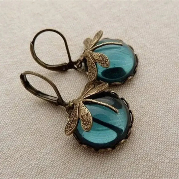 Pendientes vintage esféricos dorados con libélula
