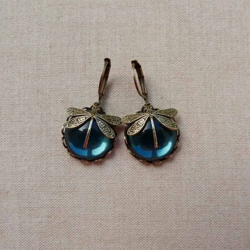 Pendientes vintage esféricos dorados con libélula