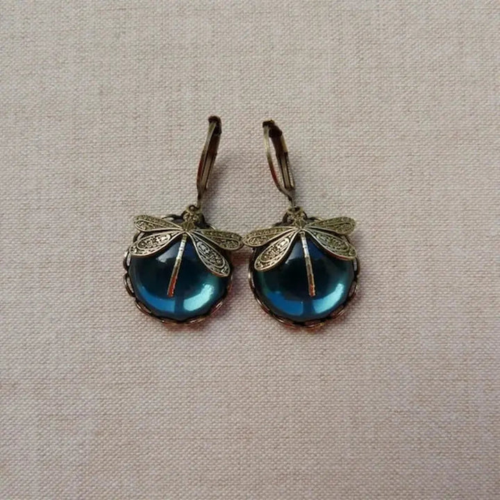 Pendientes vintage esféricos dorados con libélula