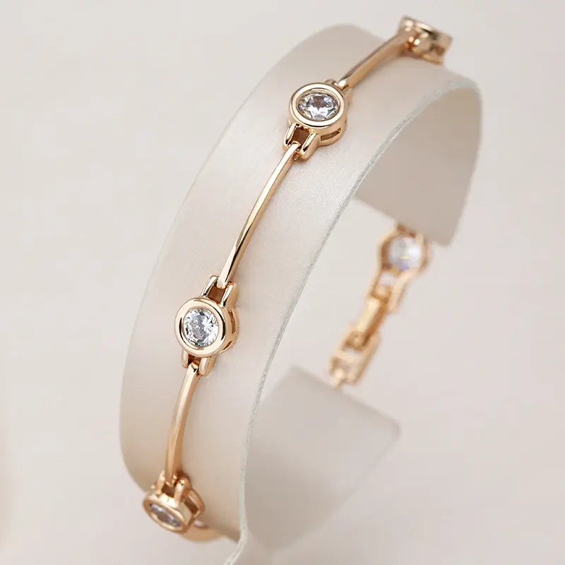 Elegante pulsera de oro con piedras de circonita