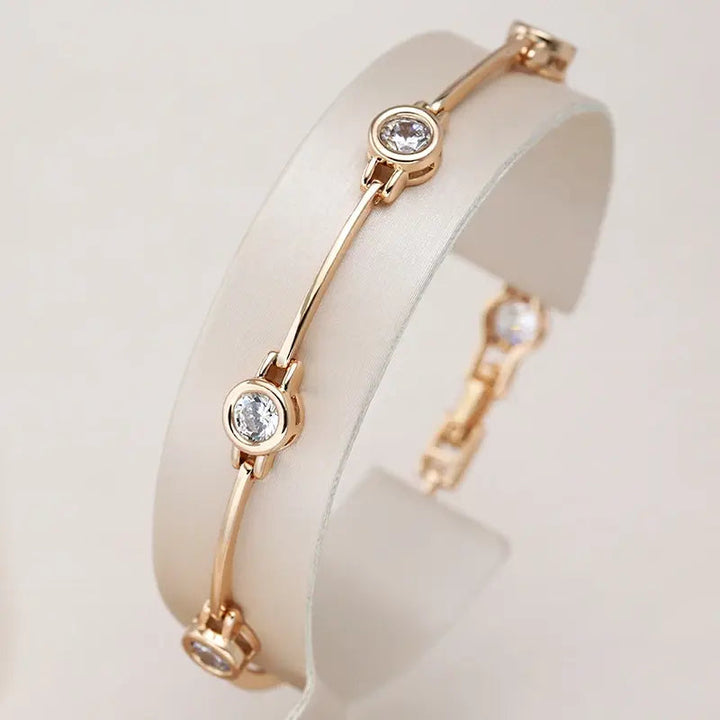 Elegante pulsera de oro con piedras de circonita