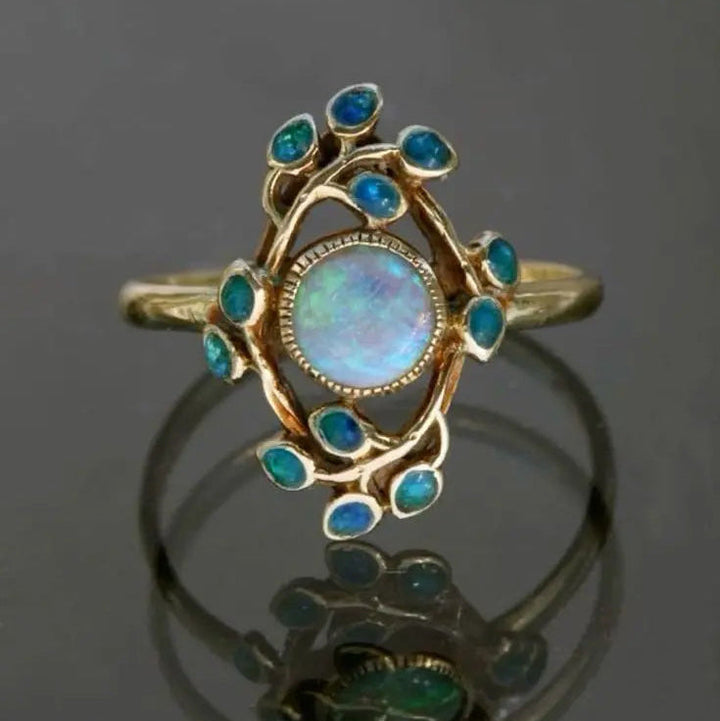 Anillo vintage azul con cristales y ópalo
